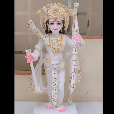 Handcrafted white marble Lord Ram idol featuring intricate carving and traditional gold detailing.