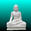 White Buddha marble statue carved from a single natural marble block.