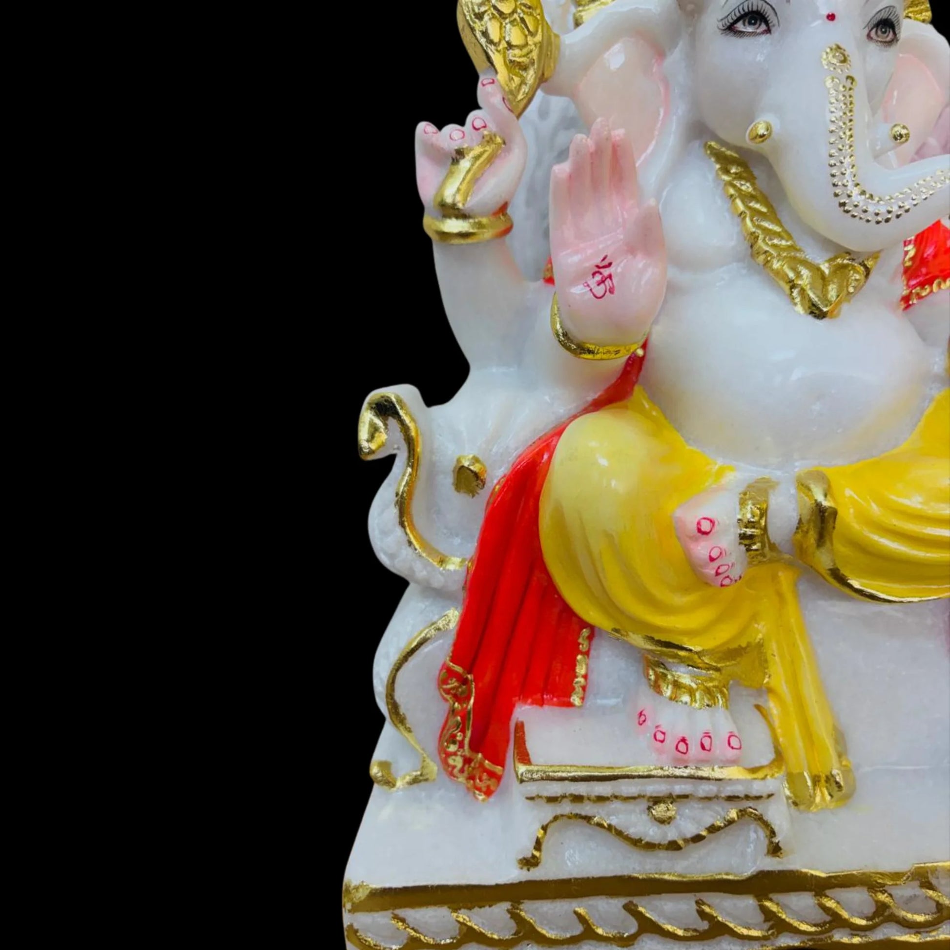 close up of Ganesh idol showing fine carving and facial detailing