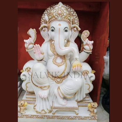 Handcrafted Ganesh sculpture in Makrana marble with traditional veena design