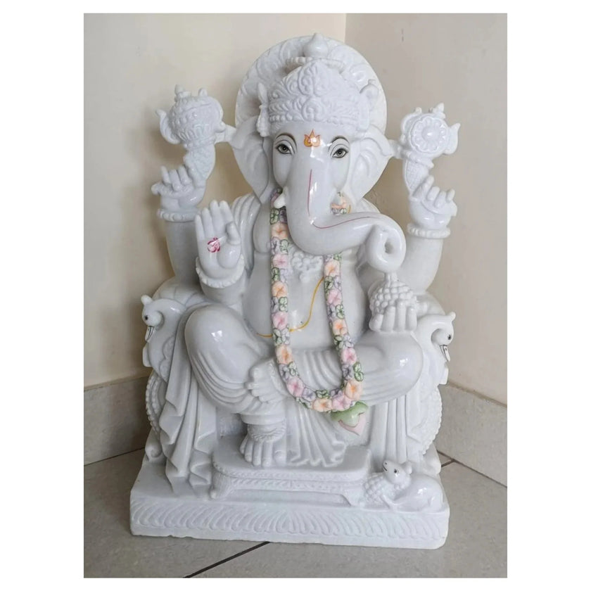 Handcrafted Makrana marble Ganesh statue with detailed carving and seated posture