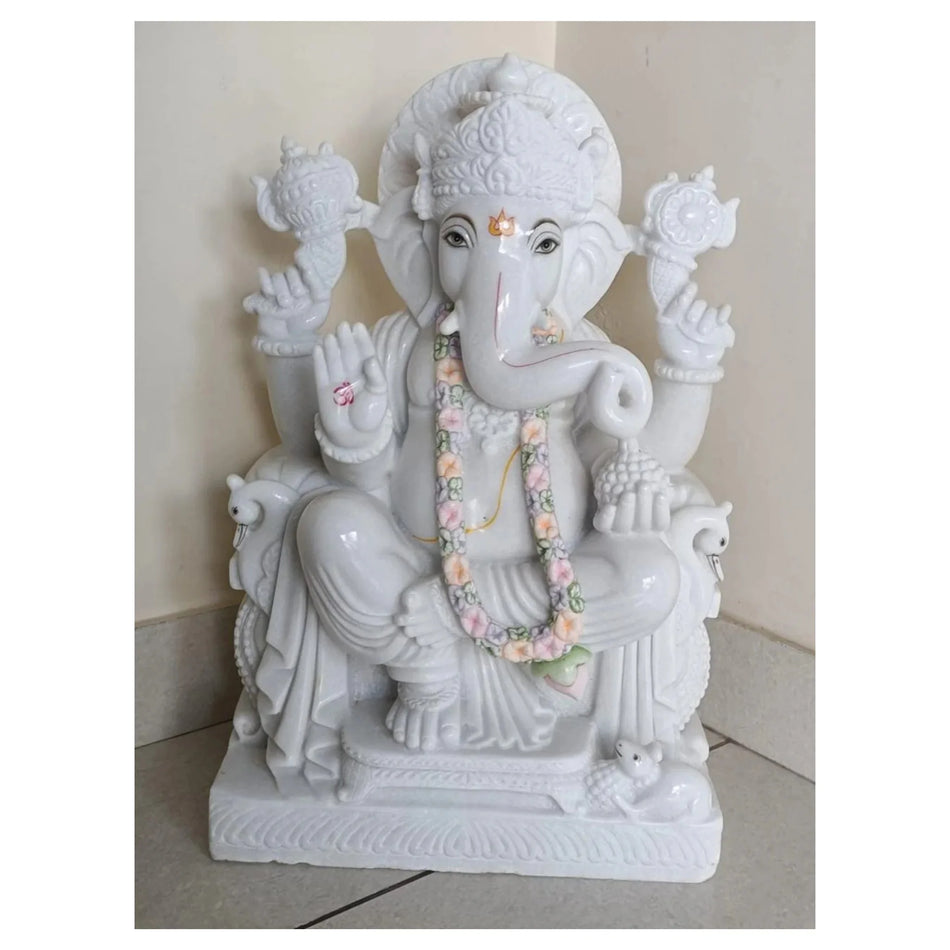 Handcrafted Makrana marble Ganesh statue with detailed carving and seated posture