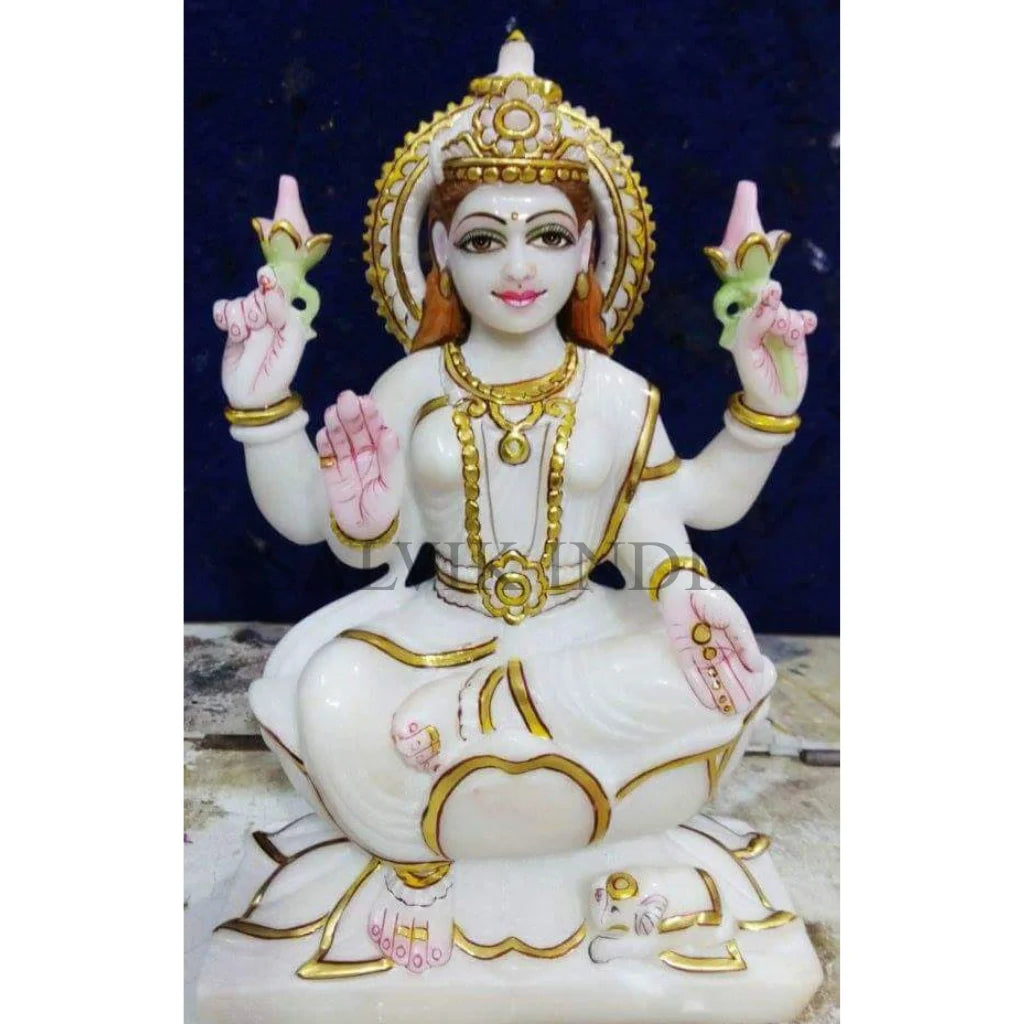 White marble Lakshmi idol handcrafted with traditional Indian carving