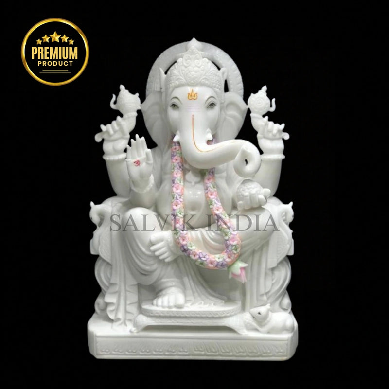 White marble Ganesh statue handcrafted from Makrana marble in sitting posture.