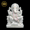 White marble Ganesh statue handcrafted from Makrana marble in sitting posture.
