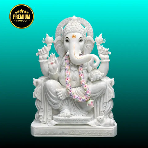 White marble Ganesh statue handcrafted from Makrana marble in sitting posture
