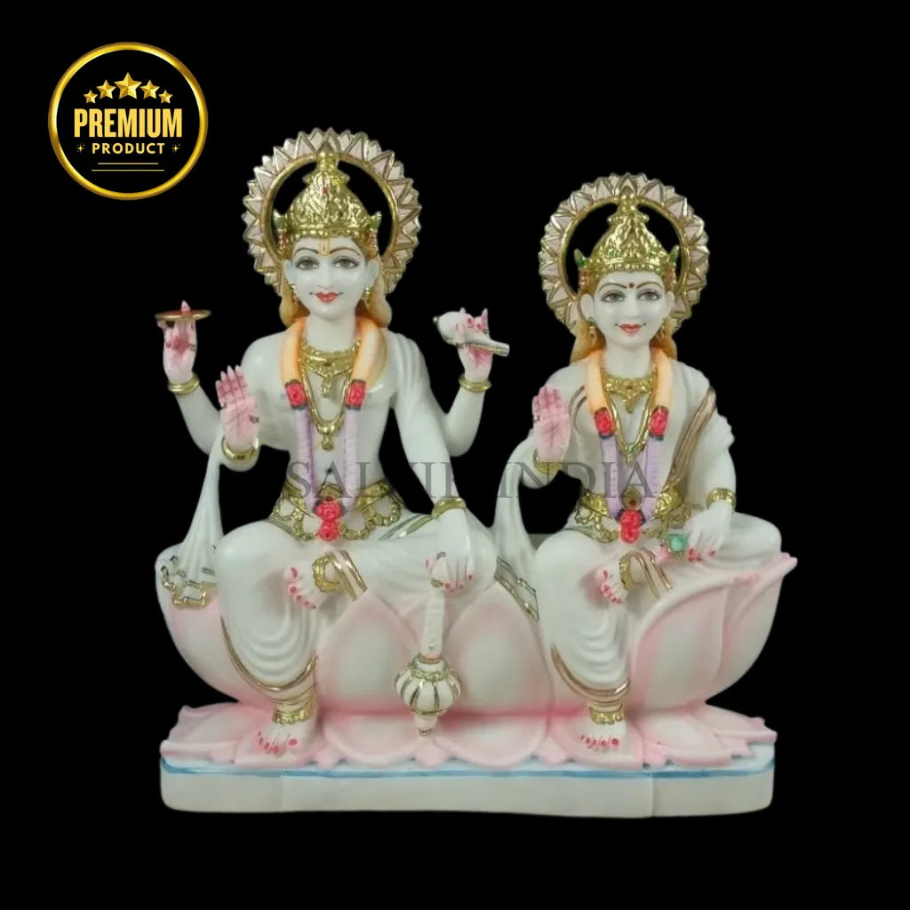 White marble Laxmi Narayan Murti with detailed carving and pastel pink lotus accents