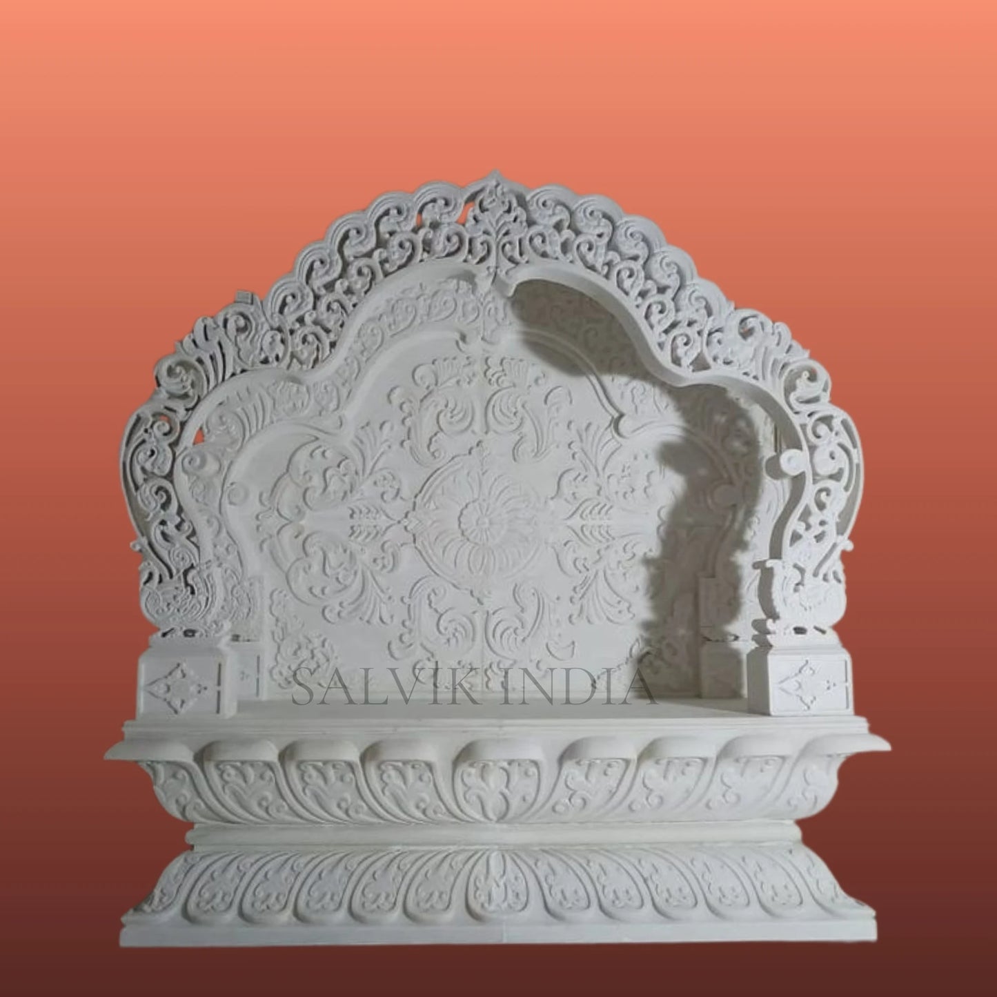 White marble mandir design with elegant carving for home temple