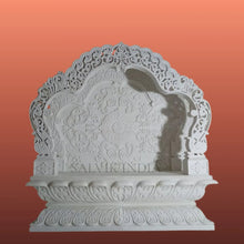 White marble mandir design with elegant carving for home temple