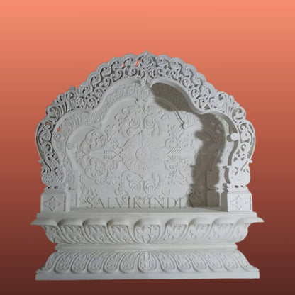 White marble mandir design with elegant carving for home temple