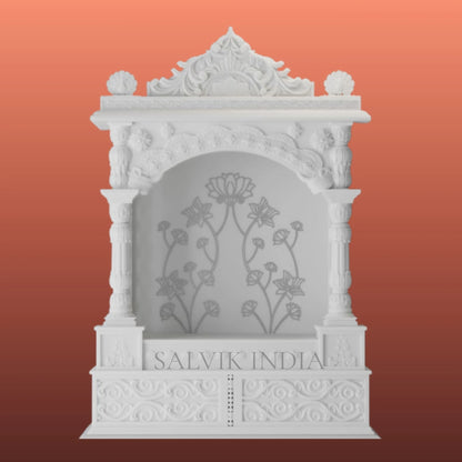 white marble temple front view with carved detailing